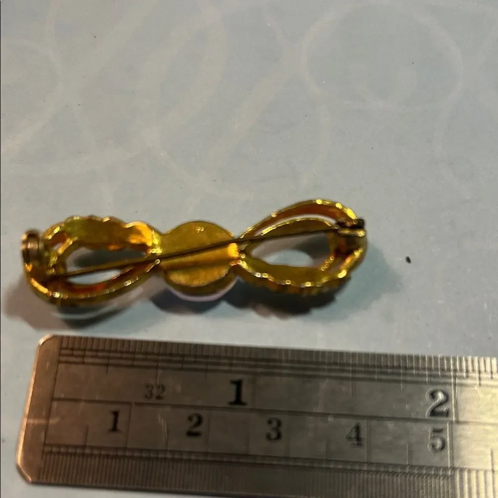 Elegant Gold Infinity Brooch - Picture 3 of 4